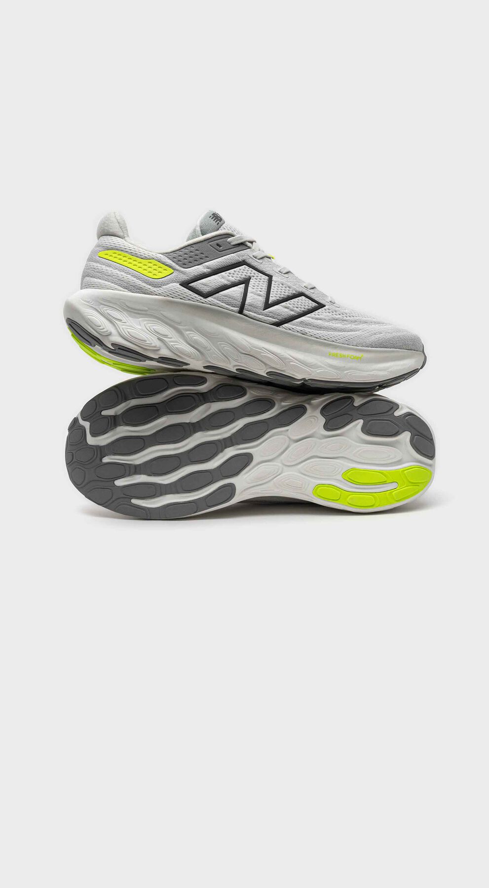 One grey Fresh Foam X 1080v13 shoe in studio on a grey background.  